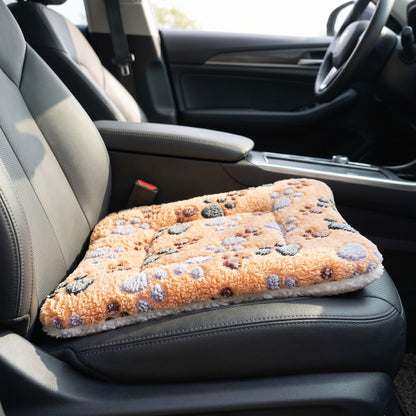 Side view of the plush pet bed in a car interior, illustrating its thickness and cozy fit on the car seat for travel comfort.
