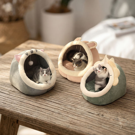 Close-up of a small foldable cotton cat bed showing plush surface and detailed stitching in natural light.
