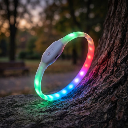Close-up of a glowing silicone LED dog collar in a dusk outdoor scene, highlighting the collar's texture and illumination.