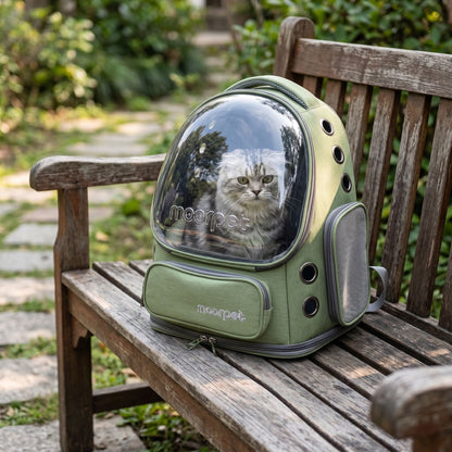 Full-body outdoor shot of a small khaki nylon cat backpack on a rustic wooden bench, showing portability and ventilation features in natural light.