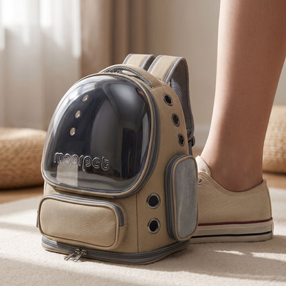 Close-up of a small khaki nylon cat carrier backpack highlighting its micro-texture, zipper, and ventilation mesh with a neutral studio background.