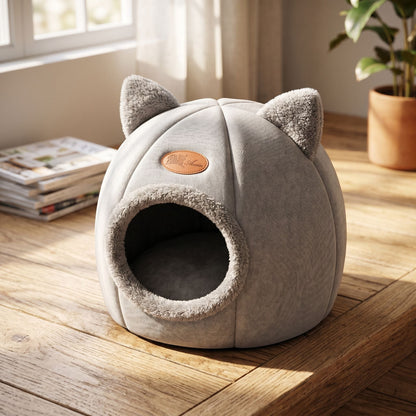Close-up of a cotton cave-style cat bed highlighting textured natural cotton fabric and cozy interior, with warm home lighting.